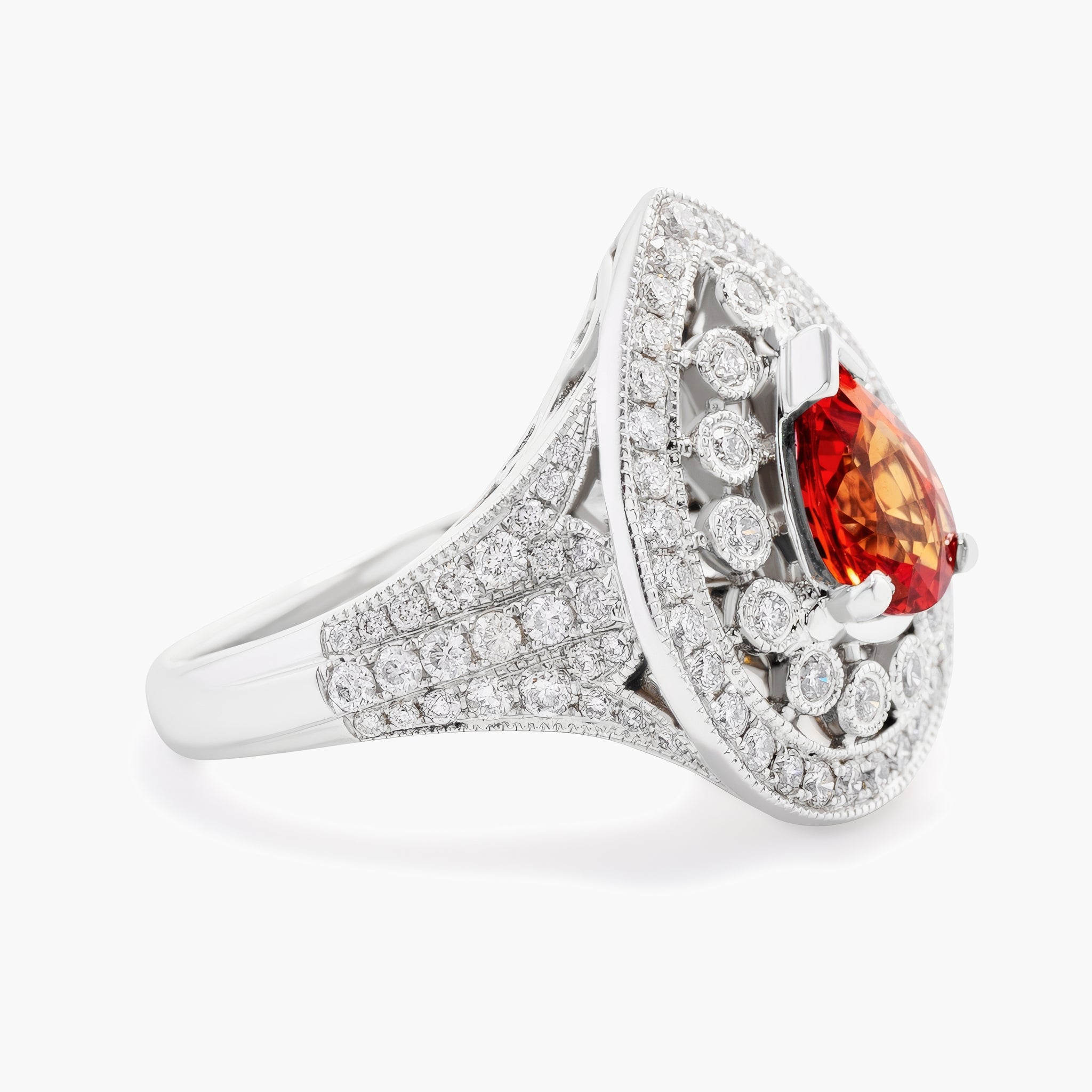 Fancy Pearshape Orange sapphire and diamond ring